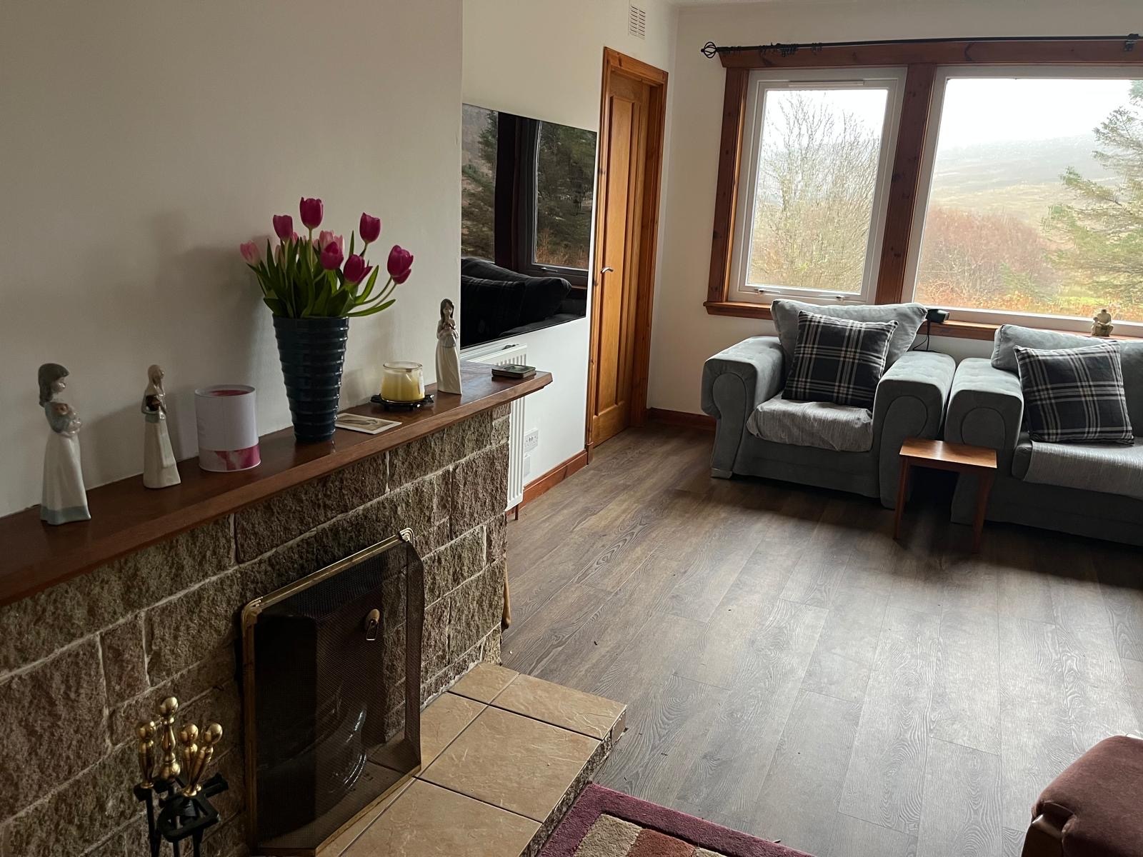 The living room fireplace at Barra Woodview