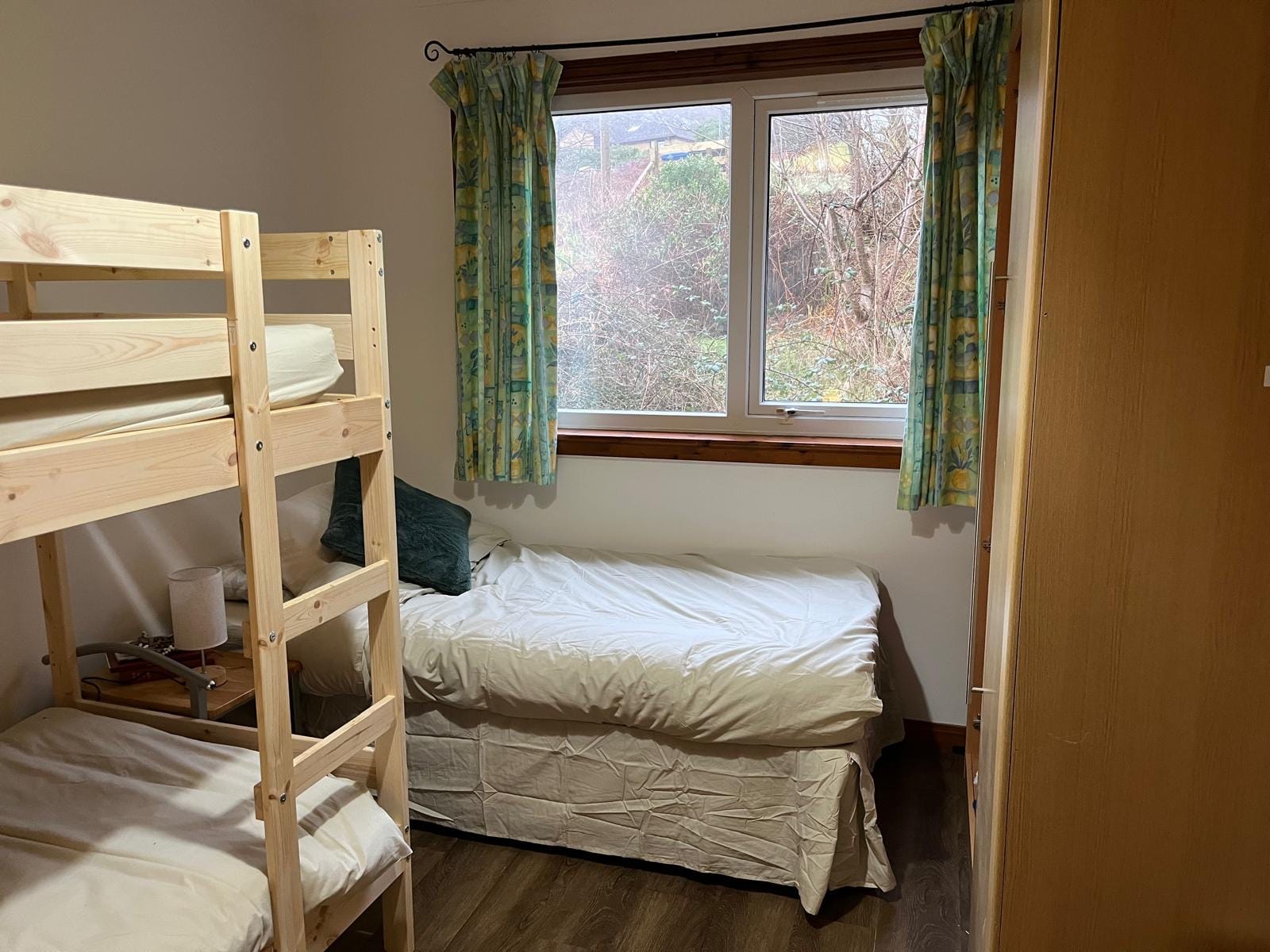 Triple room at Barra Woodview — the full single bed and garden-side window